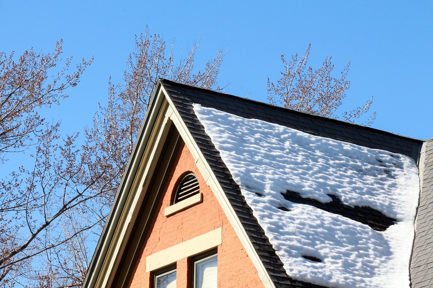 Snow on the peak of a Roof